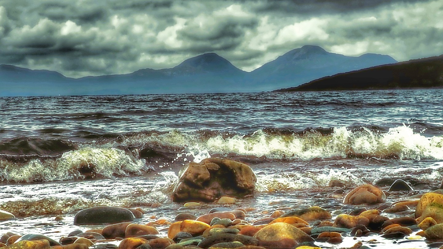 Pebble Beach Waves Dramatic Mountains Stormy Sky